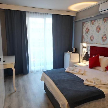 Akman City Hotel คูซาดาซี ภายนอก รูปภาพ