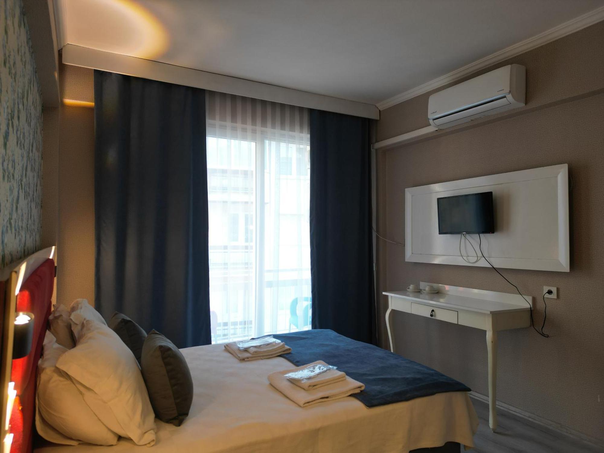 Akman City Hotel คูซาดาซี ภายนอก รูปภาพ
