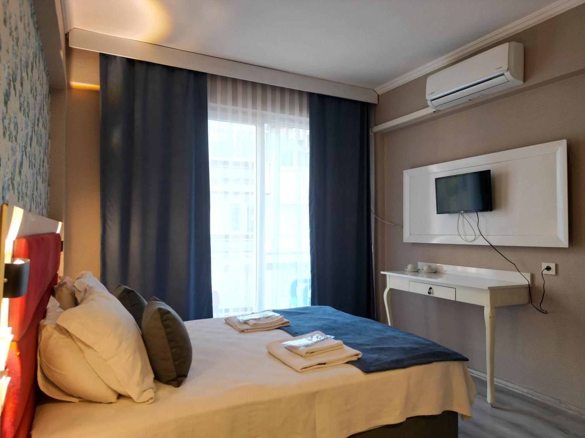 Akman City Hotel คูซาดาซี ภายนอก รูปภาพ